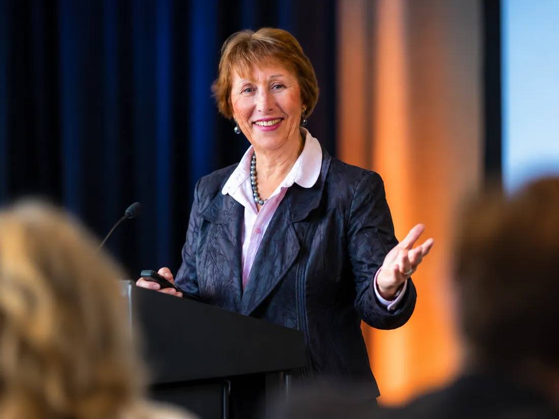 Denise Archie speaking at a podium